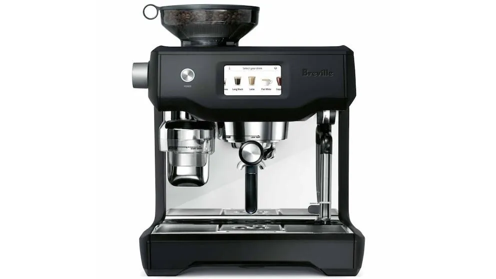 A black Breville espresso machine with a digital display, built-in grinder, steam wand, and portafilter, shown on a plain white background.