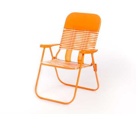 An orange metal folding chair with a slatted seat and backrest, photographed against a plain white background.